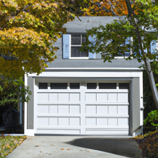 Editorial photo of a Newton, MA home with a visible garage door, driveway, and fall trees, daylight.
