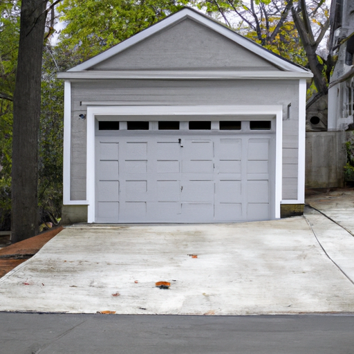 Suburban Newton home with a modern closed garage door on a two-car garage, driveway visible, no people.