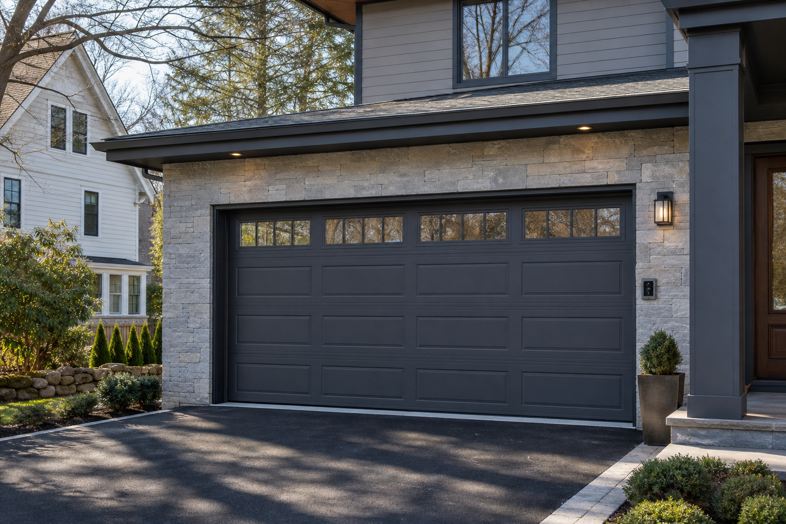 Newton home exterior with a modern garage door and smart opener setup